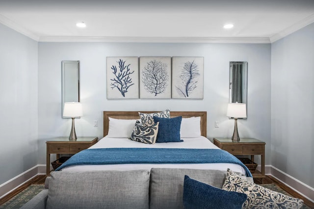 bedroom with crown molding, baseboards, and wood finished floors