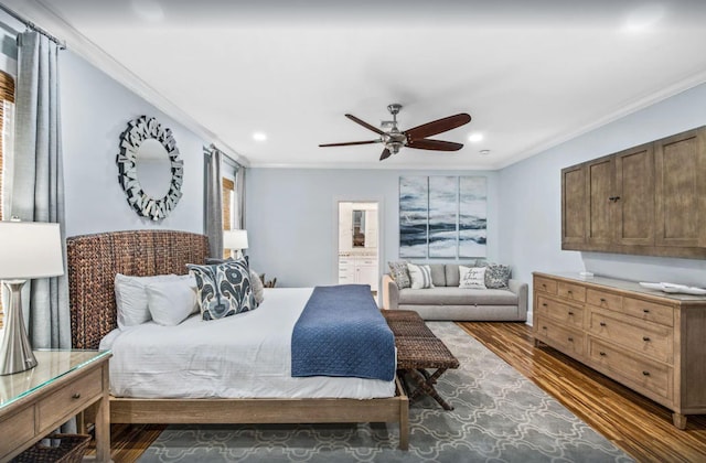 bedroom with a ceiling fan, wood finished floors, recessed lighting, ornamental molding, and ensuite bathroom