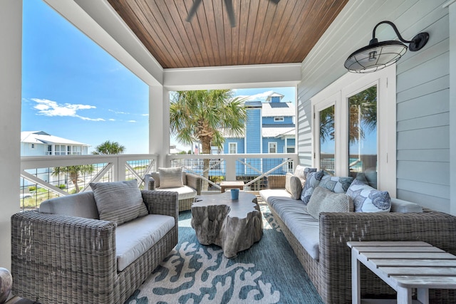 exterior space with an outdoor living space and a balcony