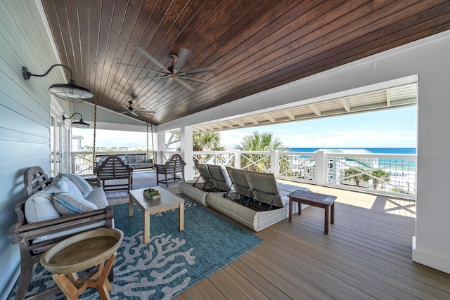 wooden terrace with a ceiling fan and an outdoor hangout area