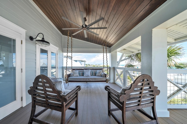 wooden deck featuring a ceiling fan