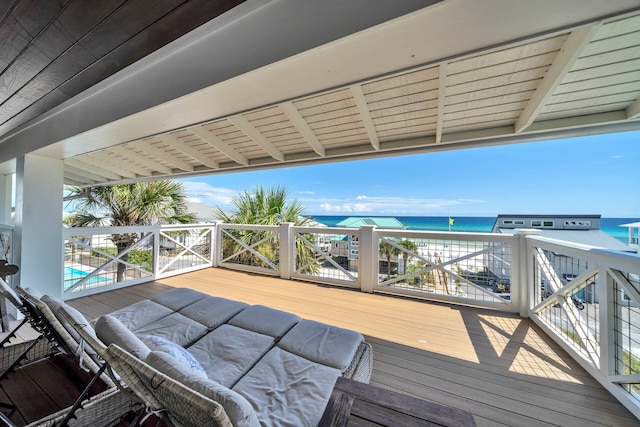 wooden deck featuring a water view