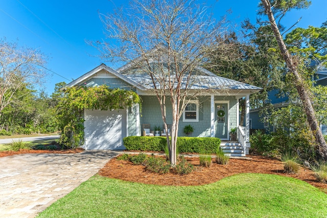 view of front of home with driveway and an attached garage