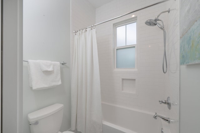 full bathroom featuring toilet and shower / tub combo with curtain