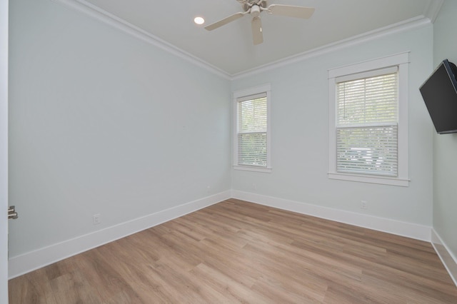 unfurnished room with a ceiling fan, crown molding, light wood-style floors, and baseboards