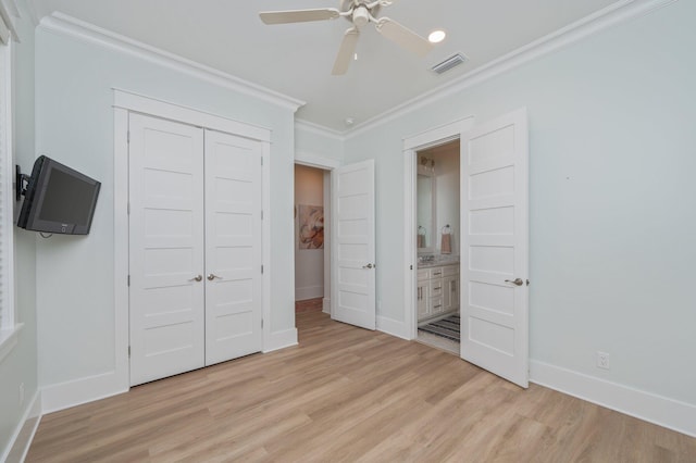 unfurnished bedroom featuring crown molding, baseboards, visible vents, and light wood finished floors