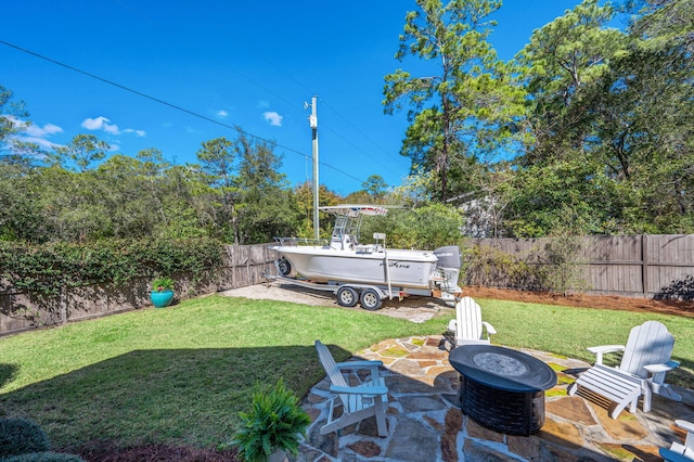 view of yard with a fenced backyard and a patio area