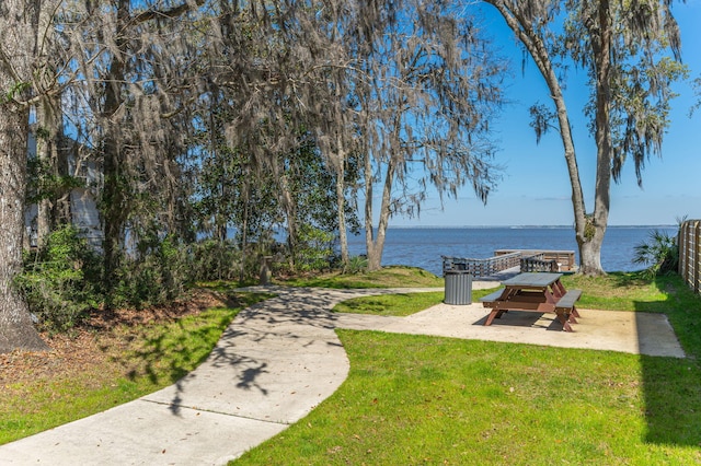 view of yard featuring a patio and a water view