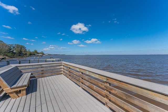 wooden deck with a water view