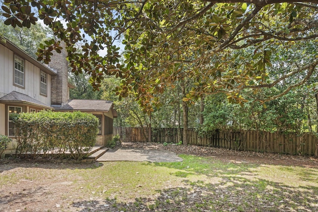 view of yard featuring a patio and fence