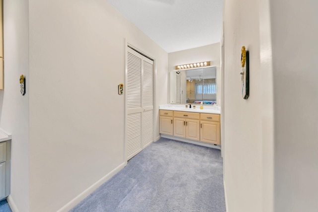 bathroom with vanity and baseboards