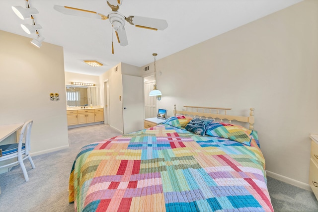 bedroom featuring visible vents, baseboards, and light colored carpet