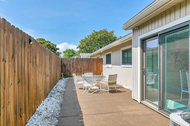 view of patio / terrace featuring outdoor dining space and a fenced backyard