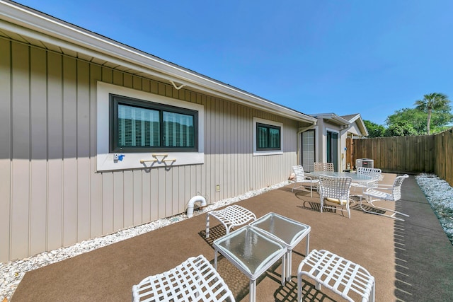 view of patio / terrace featuring outdoor dining space and fence