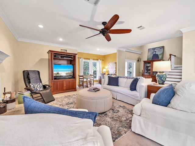 living room featuring visible vents, stairway, crown molding, and a ceiling fan