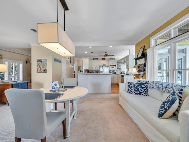 dining area featuring light carpet, visible vents, recessed lighting, and ceiling fan