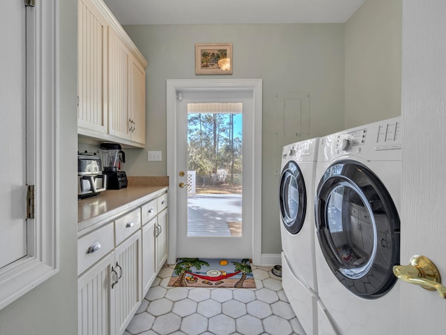 laundry area with light tile patterned floors, cabinet space, and independent washer and dryer