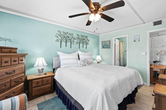 bedroom with crown molding, light tile patterned flooring, visible vents, and ceiling fan