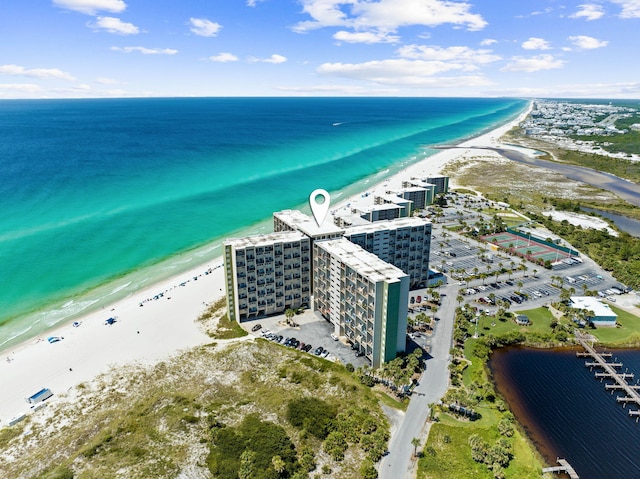 bird's eye view featuring a view of the beach and a water view