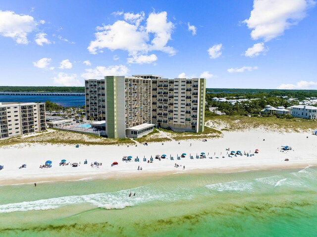 bird's eye view with a beach view and a water view