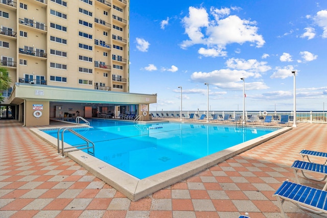 view of pool with fence