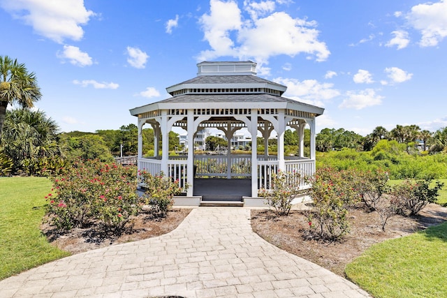 view of property's community featuring a gazebo, a yard, and a water view