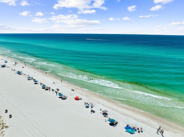 aerial view featuring a water view and a beach view