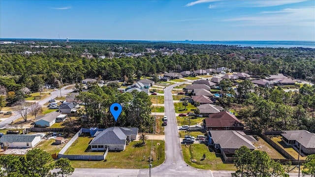 bird's eye view featuring a residential view and a water view