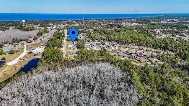 birds eye view of property featuring a residential view and a water view