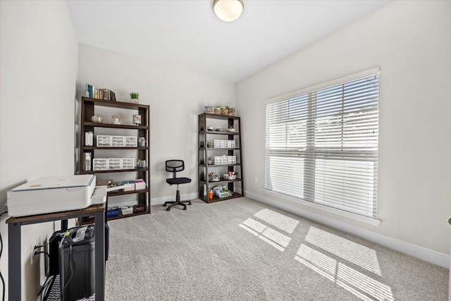 carpeted office featuring baseboards