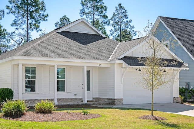 single story home featuring an attached garage, concrete driveway, roof with shingles, and a front yard