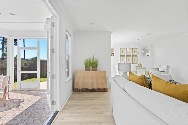 living room with recessed lighting, light wood-type flooring, and crown molding