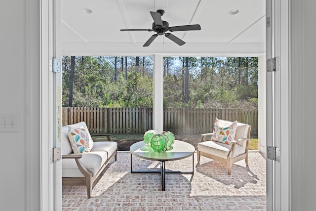 view of patio / terrace with a fenced backyard, an outdoor living space, and a ceiling fan