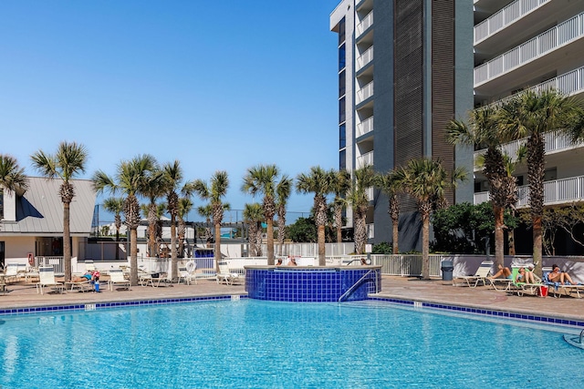 pool featuring a patio and fence