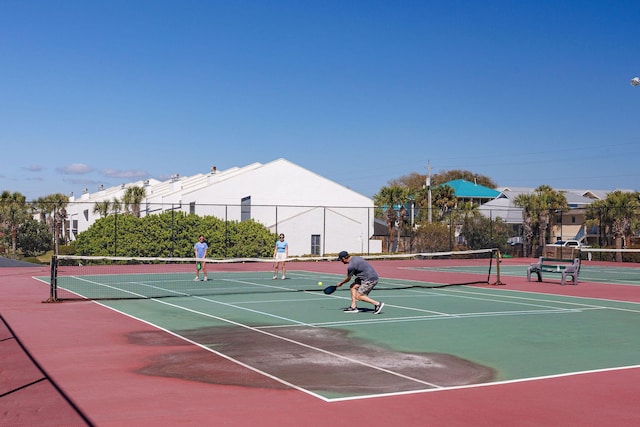 view of sport court featuring community basketball court and fence