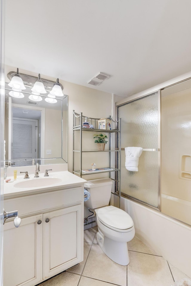 full bath featuring visible vents, toilet, tile patterned flooring, bath / shower combo with glass door, and vanity