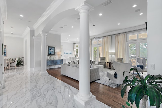2940 Pine Valley Dr, Miramar Beach, FL 32550 - living area with visible vents, ornate columns, a ceiling fan, and a healthy amount of sunlight
