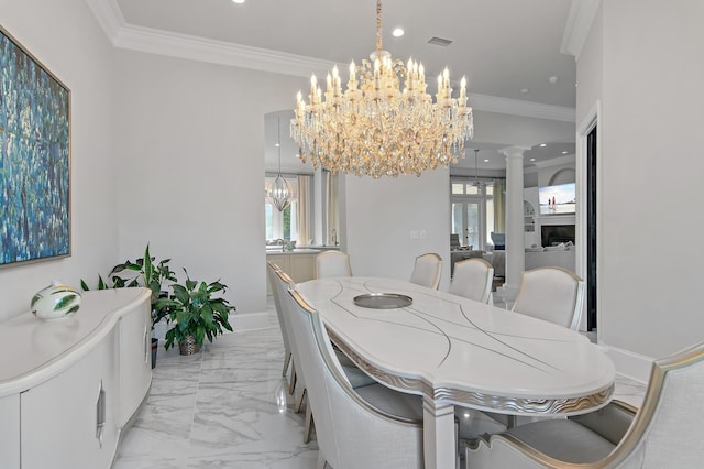 2940 Pine Valley Dr, Miramar Beach, FL 32550 - dining space with crown molding, decorative columns, visible vents, a chandelier, and marble finish floor