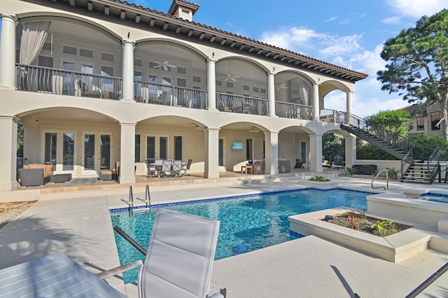 2940 Pine Valley Dr, Miramar Beach, FL 32550 - back of property with a patio, a balcony, an outdoor pool, french doors, and stairs