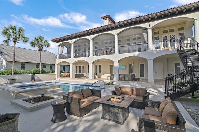 2940 Pine Valley Dr, Miramar Beach, FL 32550 - rear view of house featuring an outdoor living space with a fire pit, ceiling fan, a patio area, a balcony, and stairs