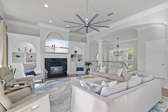2940 Pine Valley Dr, Miramar Beach, FL 32550 - living room with ornate columns, ornamental molding, and built in shelves