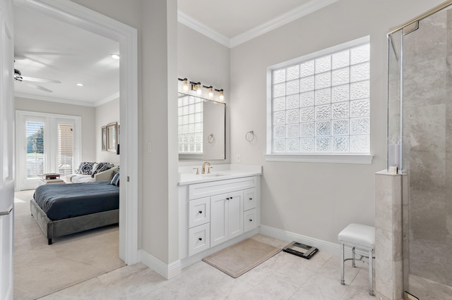 2940 Pine Valley Dr, Miramar Beach, FL 32550 - ensuite bathroom featuring tiled shower, baseboards, crown molding, and ceiling fan