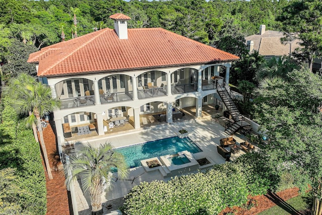 2940 Pine Valley Dr, Miramar Beach, FL 32550 - back of property with a patio, stairs, a tile roof, and a balcony