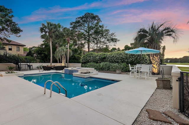 2940 Pine Valley Dr, Miramar Beach, FL 32550 - pool at dusk with a patio and a pool with connected hot tub