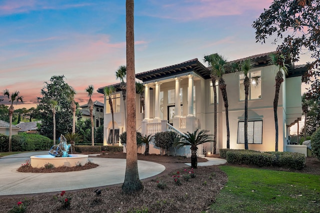 2940 Pine Valley Dr, Miramar Beach, FL 32550 - view of front of house with curved driveway, stucco siding, and a tiled roof