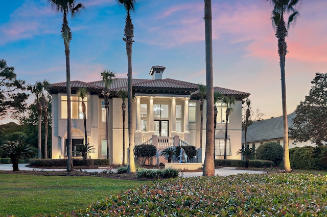 2940 Pine Valley Dr, Miramar Beach, FL 32550 - view of front facade featuring a yard, stucco siding, and a tile roof