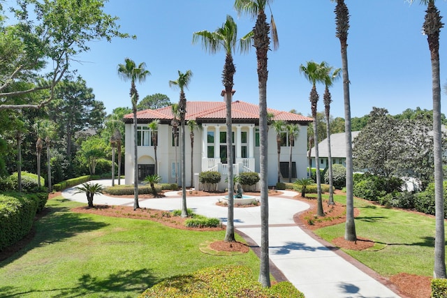 2940 Pine Valley Dr, Miramar Beach, FL 32550 - mediterranean / spanish house featuring stucco siding, a tile roof, and a front yard