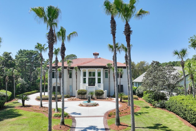 2940 Pine Valley Dr, Miramar Beach, FL 32550 - view of front of house featuring stucco siding, a front lawn, and a tiled roof