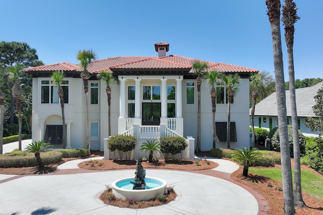 2940 Pine Valley Dr, Miramar Beach, FL 32550 - mediterranean / spanish-style home featuring stucco siding, a tile roof, and french doors