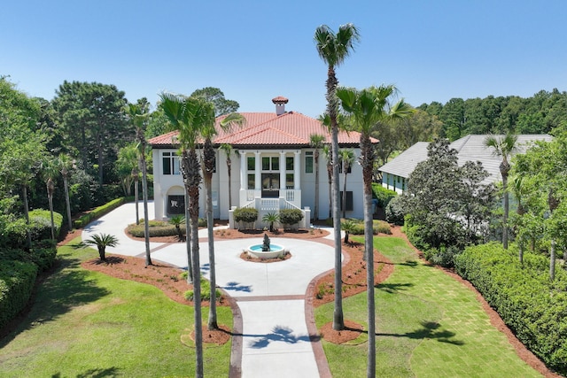 2940 Pine Valley Dr, Miramar Beach, FL 32550 - mediterranean / spanish-style house featuring stairs, a tile roof, a front yard, and stucco siding